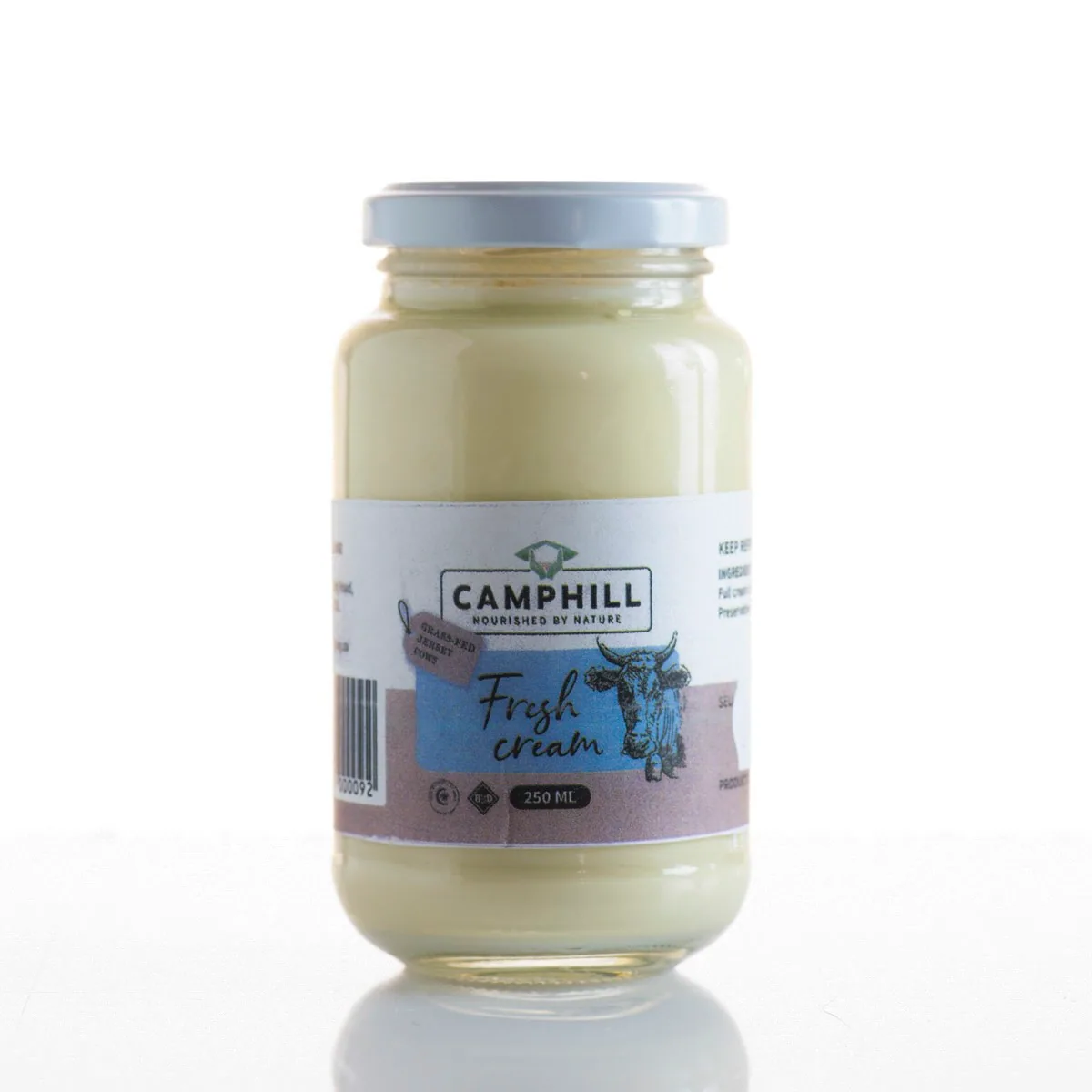 A 250 ml glass jar of thick Camphill fresh cream, the label tagged grass-fed Jersey cows.